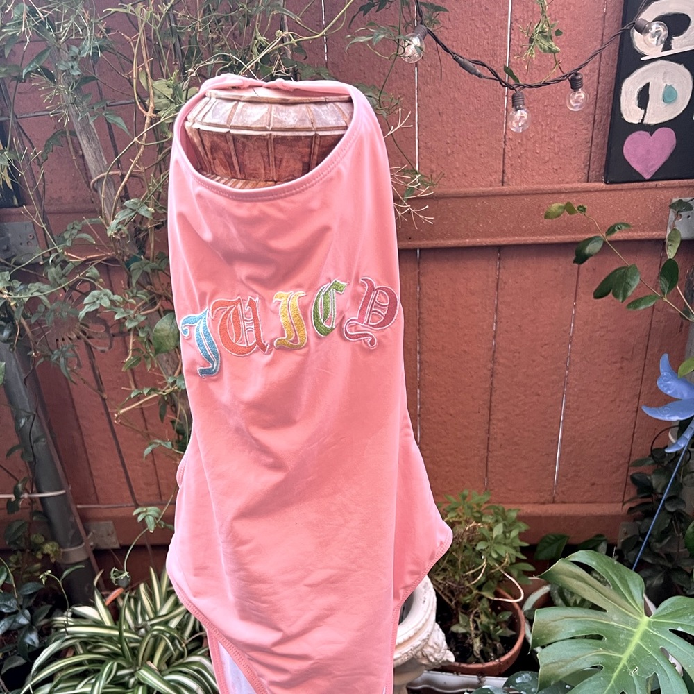 Size large, Juicy Couture, high cut one piece bathing suit. Color pale pink.